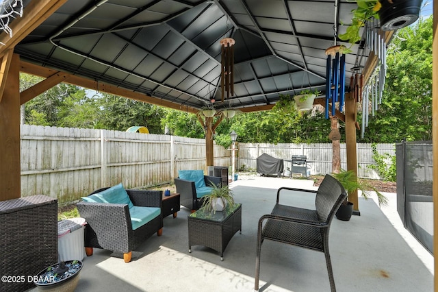 1720 Hope Dr, Ormond Beach, FL 32174 - fenced backyard featuring an outdoor living space, a patio area, a gazebo, and grilling area