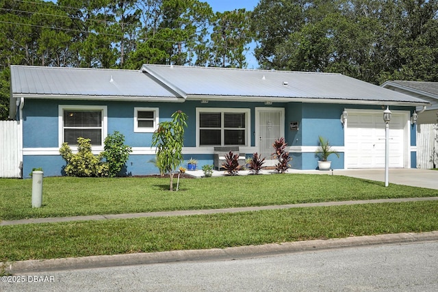 1720 Hope Dr, Ormond Beach, FL 32174 - ranch-style home with stucco siding, a garage, a metal roof, and concrete driveway