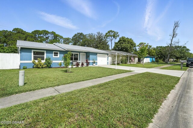 1720 Hope Dr, Ormond Beach, FL 32174 - ranch-style home featuring concrete driveway, an attached garage, a metal roof, and stucco siding