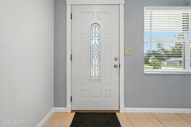 1720 Hope Dr, Ormond Beach, FL 32174 - foyer entrance with baseboards and light wood finished floors