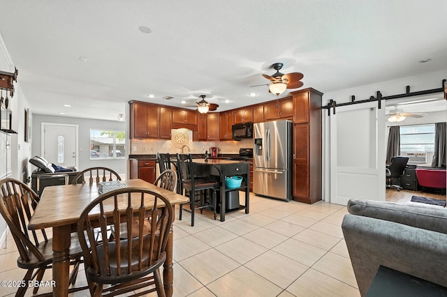1720 Hope Dr, Ormond Beach, FL 32174 - dining area with ceiling fan, a barn door, light tile patterned floors, recessed lighting, and an office area