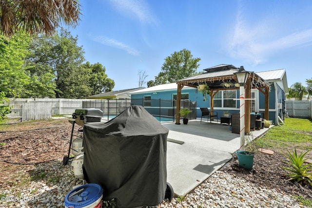 1720 Hope Dr, Ormond Beach, FL 32174 - fenced backyard with a gazebo, grilling area, outdoor lounge area, and a patio