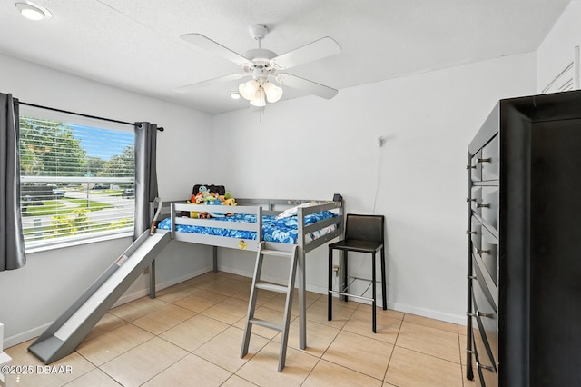 1720 Hope Dr, Ormond Beach, FL 32174 - bedroom with light tile patterned floors and a ceiling fan