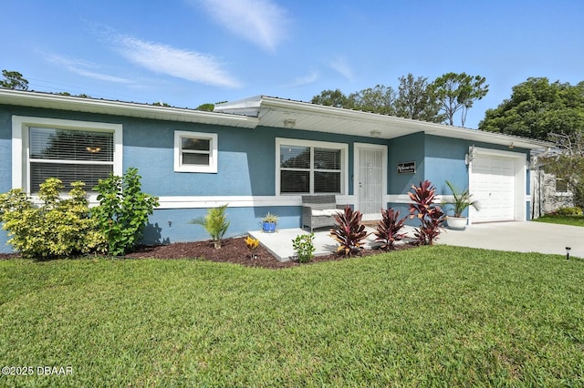 1720 Hope Dr, Ormond Beach, FL 32174 - view of front of home featuring an attached garage, stucco siding, concrete driveway, and a front lawn