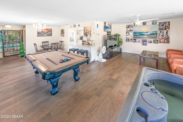 recreation room featuring billiards, hardwood / wood-style flooring, and a chandelier