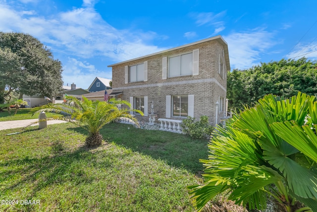 view of front of home with a front yard