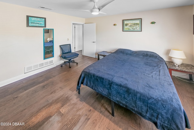 bedroom with wood-type flooring and ceiling fan