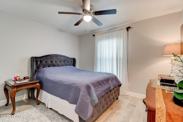 bedroom featuring light wood-type flooring and ceiling fan