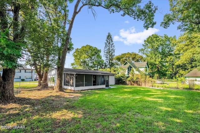 461 Brentwood Dr, Daytona Beach, FL 32117 - fenced backyard featuring a sunroom