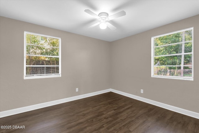 461 Brentwood Dr, Daytona Beach, FL 32117 - spare room featuring plenty of natural light, dark wood-type flooring, and ceiling fan