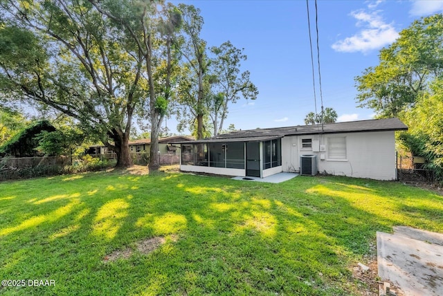 461 Brentwood Dr, Daytona Beach, FL 32117 - rear view of property with a sunroom and concrete block siding