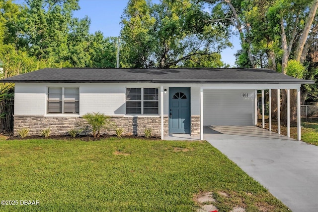 461 Brentwood Dr, Daytona Beach, FL 32117 - view of front of property with stone siding, driveway, and an attached carport