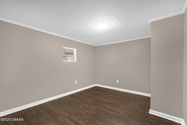 461 Brentwood Dr, Daytona Beach, FL 32117 - empty room featuring dark wood-type flooring, crown molding, and a textured ceiling