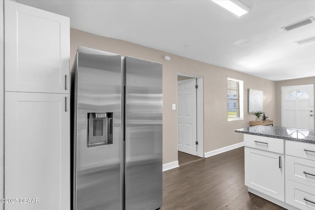 461 Brentwood Dr, Daytona Beach, FL 32117 - kitchen with stainless steel fridge, white cabinets, dark wood-type flooring, and stone counters