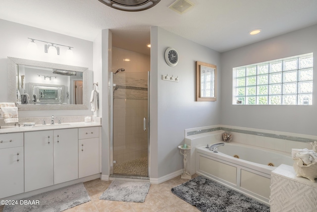 5452 Saint Regis Way, Port Orange, FL 32128 - full bathroom with a jetted tub, vanity, a stall shower, and tile patterned flooring