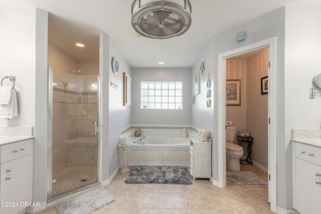 5452 Saint Regis Way, Port Orange, FL 32128 - bathroom with a stall shower, a bath, vanity, tile patterned flooring, and recessed lighting