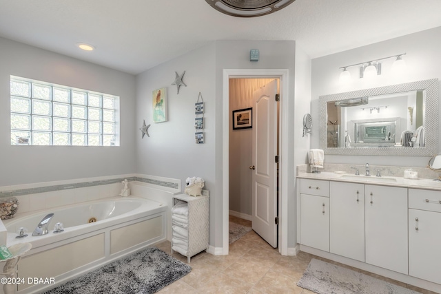 5452 Saint Regis Way, Port Orange, FL 32128 - bathroom with vanity, a whirlpool tub, and tile patterned flooring