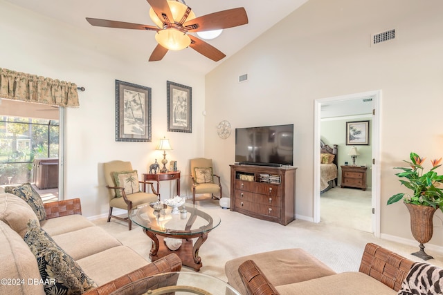 5452 Saint Regis Way, Port Orange, FL 32128 - living area with light colored carpet, high vaulted ceiling, and ceiling fan