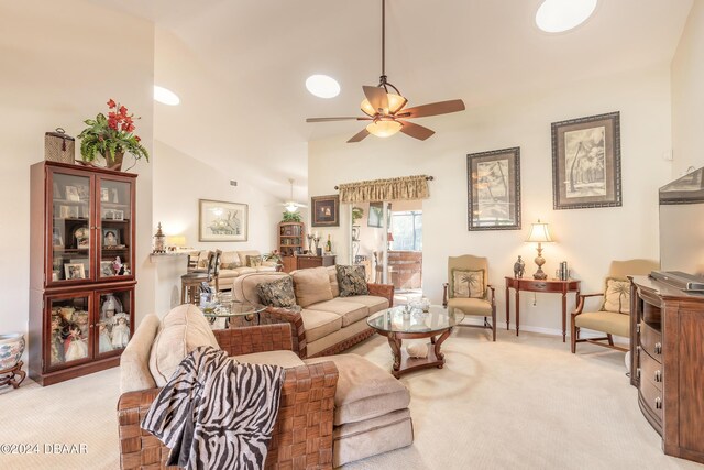 5452 Saint Regis Way, Port Orange, FL 32128 - living room featuring light colored carpet, ceiling fan, and vaulted ceiling