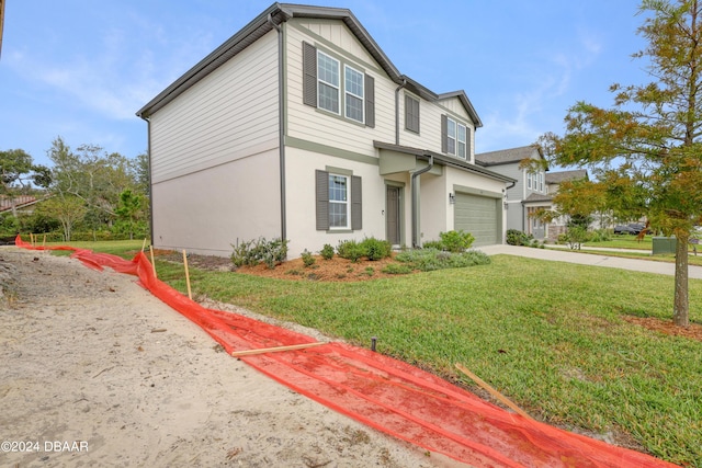 view of front of home featuring a garage and a front yard