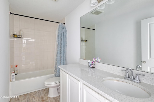 full bathroom featuring toilet, vanity, shower / bath combination with curtain, and hardwood / wood-style floors