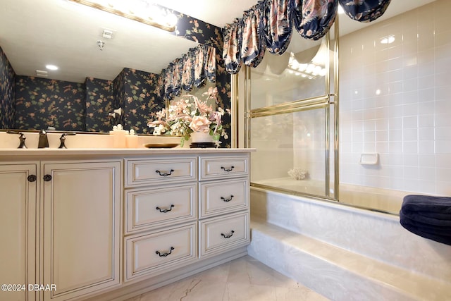 bathroom featuring shower / bath combination with glass door and vanity