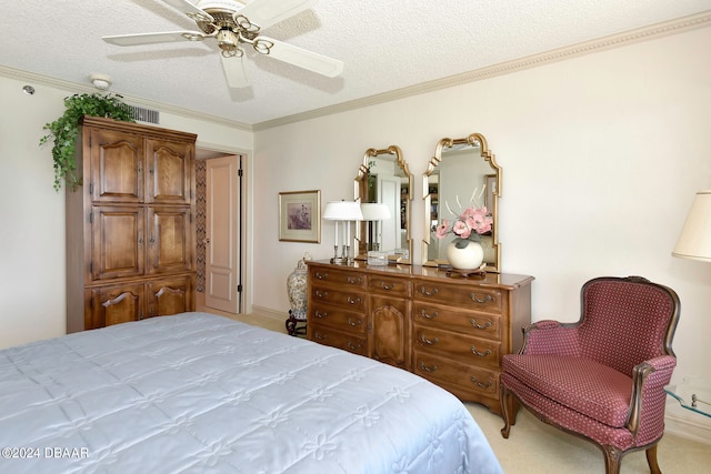 carpeted bedroom with ceiling fan, a textured ceiling, and ornamental molding