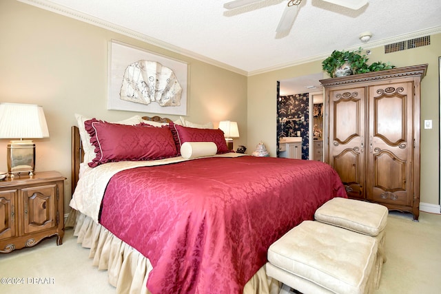 carpeted bedroom with ornamental molding, a textured ceiling, and ceiling fan