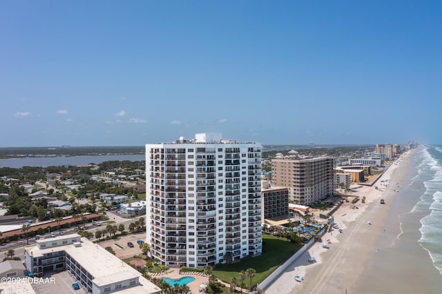 bird's eye view featuring a view of the beach and a water view