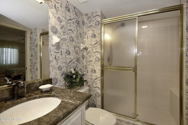 2425 S Atlantic Ave Unit 1403, Daytona Beach, FL 32118 - full bath with wallpapered walls, a shower stall, toilet, and vanity