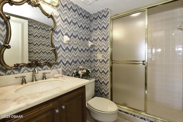 2425 S Atlantic Ave Unit 1403, Daytona Beach, FL 32118 - full bath featuring a stall shower, toilet, wallpapered walls, and vanity