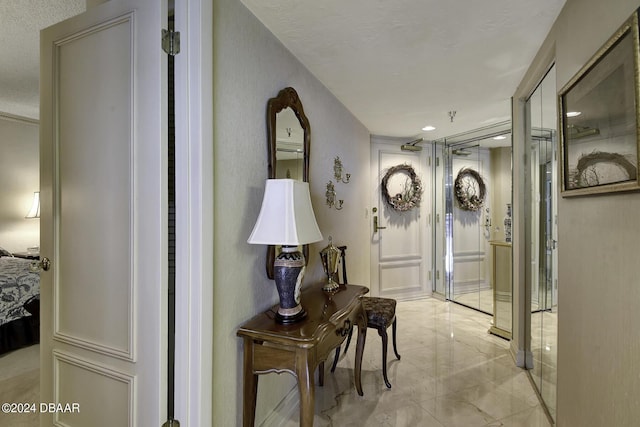 2425 S Atlantic Ave Unit 1403, Daytona Beach, FL 32118 - hallway with light marble finish flooring and recessed lighting