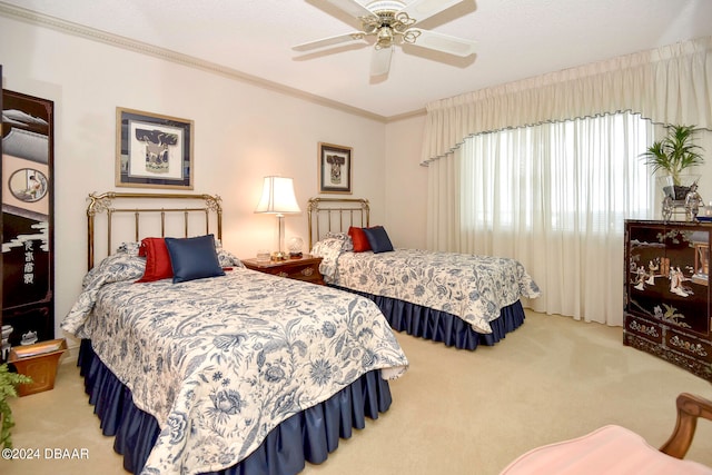 bedroom with ornamental molding, a textured ceiling, ceiling fan, and carpet floors