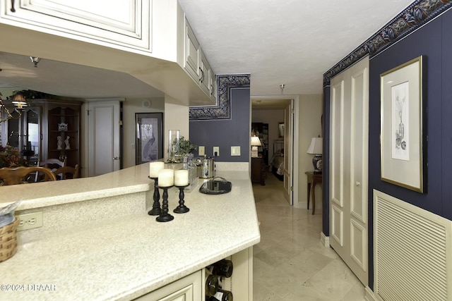 2425 S Atlantic Ave Unit 1403, Daytona Beach, FL 32118 - kitchen featuring light countertops and baseboards