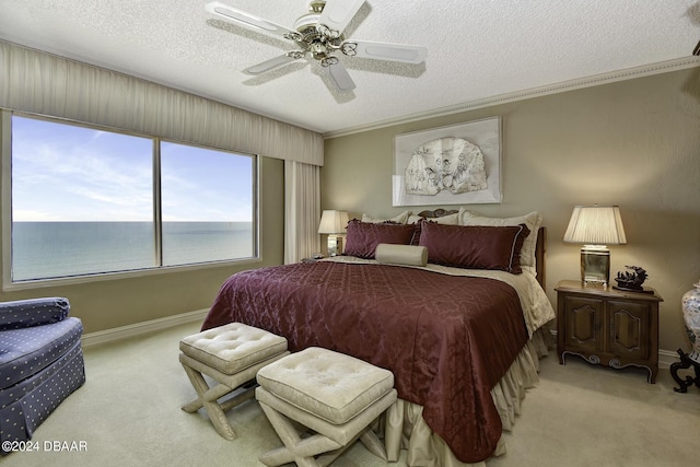 2425 S Atlantic Ave Unit 1403, Daytona Beach, FL 32118 - bedroom with carpet, a textured ceiling, a ceiling fan, baseboards, and crown molding