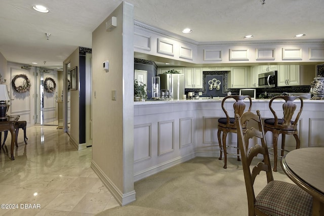2425 S Atlantic Ave Unit 1403, Daytona Beach, FL 32118 - kitchen featuring appliances with stainless steel finishes, baseboards, recessed lighting, a peninsula, and tasteful backsplash