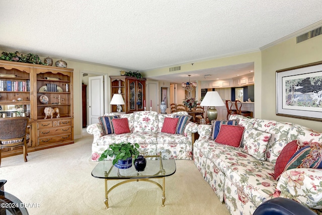 carpeted living room featuring a textured ceiling, an inviting chandelier, and ornamental molding