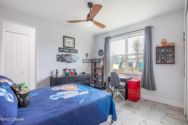 bedroom featuring ceiling fan and a closet