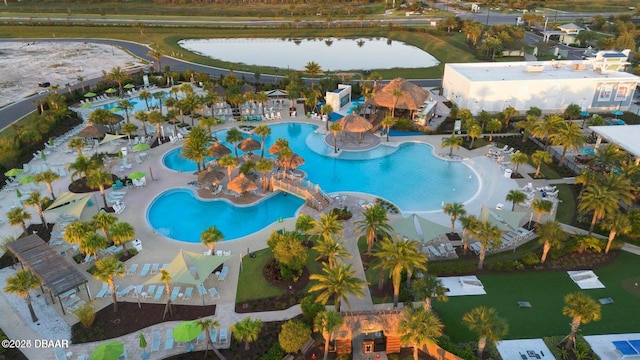 birds eye view of property with a water view