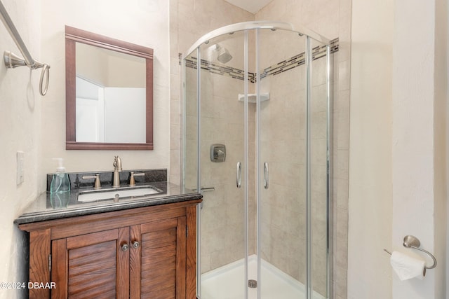 bathroom with vanity and an enclosed shower