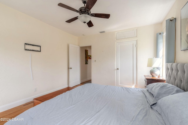 bedroom with ceiling fan and light hardwood / wood-style flooring