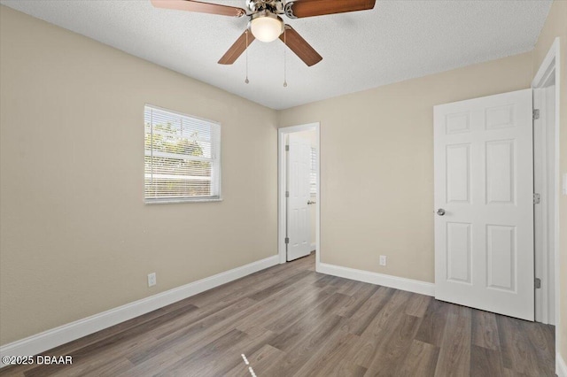 unfurnished bedroom with ceiling fan, hardwood / wood-style floors, and a textured ceiling