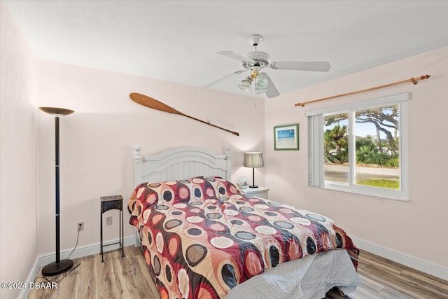 bedroom featuring ceiling fan and light hardwood / wood-style flooring