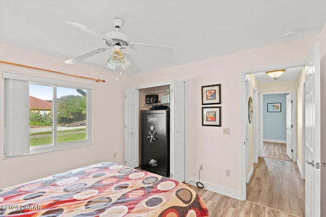 bedroom with ceiling fan and light hardwood / wood-style flooring