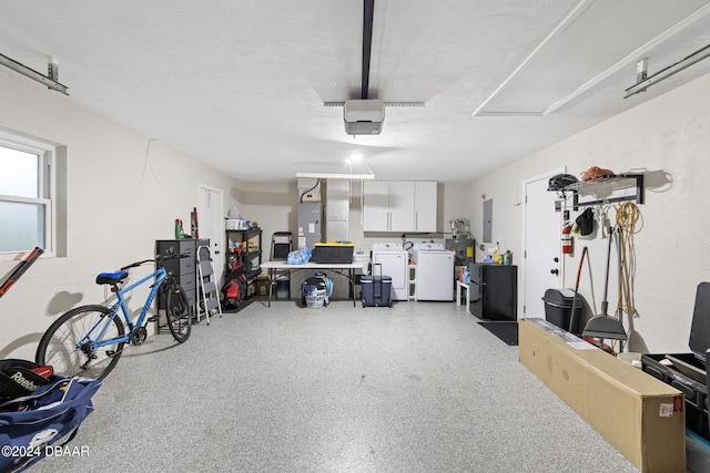 garage with washer and dryer and electric panel