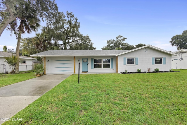 ranch-style home with a garage and a front yard