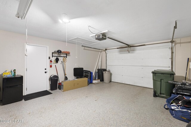 garage with black fridge