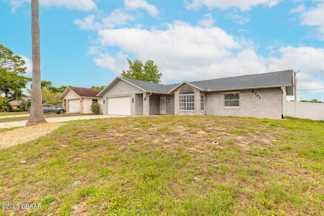 2721 Royal Palm Dr, Edgewater, FL 32141 - ranch-style house with a garage, brick siding, and concrete driveway