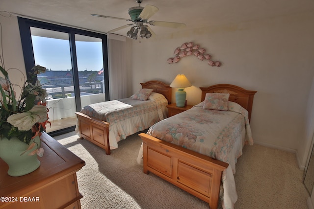 bedroom with access to outside, light colored carpet, and ceiling fan