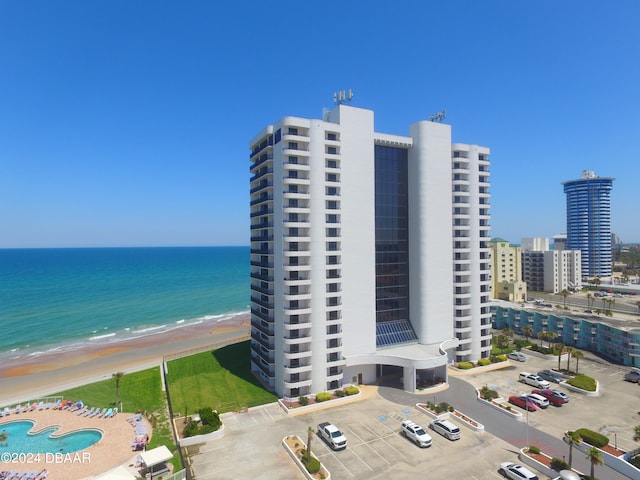 bird's eye view featuring a beach view and a water view